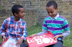 boys with red Letterbox parcel